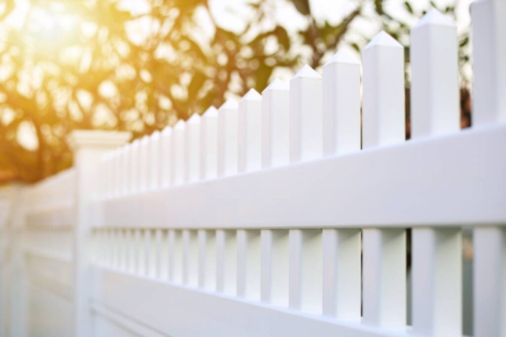 A white picket fence outside a home near Nicholasville, KY